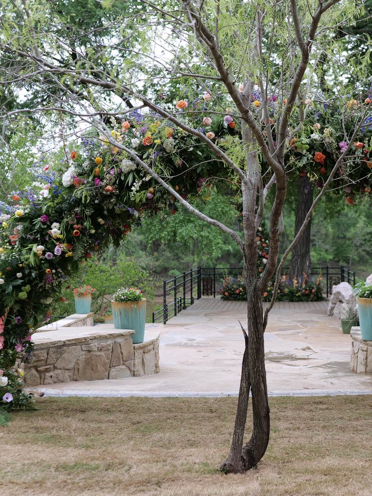 Floral arch built around a mature tree